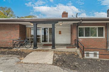 Dayton apartment for rent - A brick house with a bicycle parked in front.