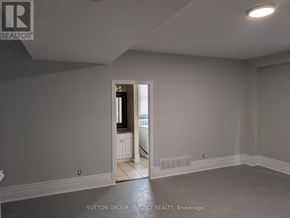 London East (East F) house for rent - A room with a doorway leading to another room.