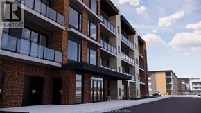 Windsor condo for rent - A modern apartment building with a brick facade and large windows.