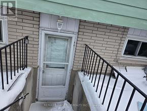 London North (North H) house for rent - A snow-covered front porch with a white door and black railings.