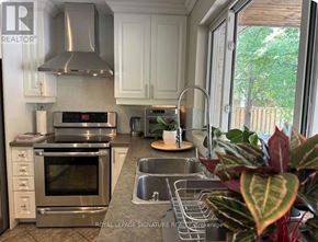 Oakville (Wo West) house for rent - A kitchen with a stainless steel oven and sink.