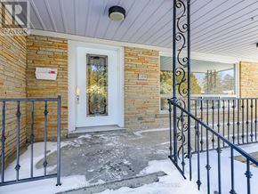 Vaughan (Crestwood-Springfarm-Yorkhill) house for rent - A house with a white door and a black metal railing.