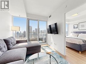 Toronto (Church-Yonge Corridor) condo for rent - A cityscape with tall buildings and a clear sky.