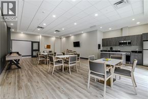 Brantford apartment for rent - A dining room with a wooden floor and white walls.