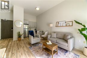 Brantford apartment for rent - A living room with a couch, chair, and coffee table.