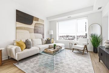 Cambridge apartment for rent - A modern living room with a large abstract painting on the wall.