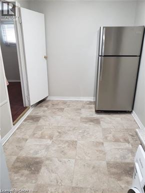 Hamilton house for rent - A kitchen with a fridge and a washing machine.