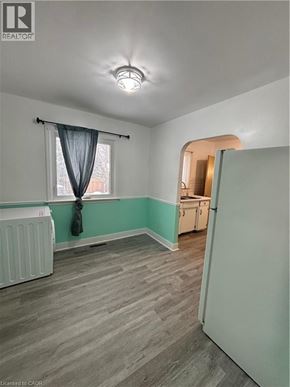 St. Catharines house for rent - A room with a window and a radiator.