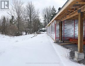 Centre Hastings multi-family for rent - A construction site with a wooden framework and insulation boards.