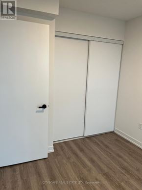 Vaughan (Vaughan Corporate Centre) condo for rent - A white door is on the left and a white closet door is on the right.