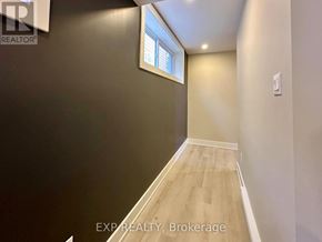 Ottawa house for rent - A room with a window and wooden flooring.