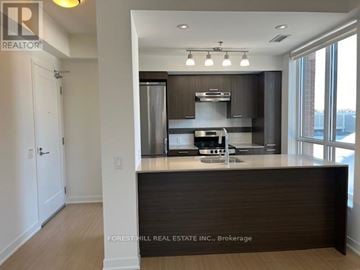 Toronto (Forest Hill South) house for rent - A kitchen with a counter top and a stainless steel refrigerator.