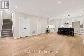 For rent in Russell - A spacious room with wooden flooring and a dining area set up with a table and chairs.