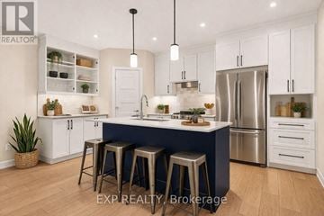 Russell other for rent - A modern kitchen with white cabinets and a blue island.
