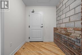 Carleton Place multi-family for rent - A white door in a room with a brick wall.