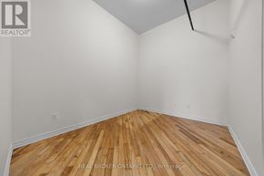 Carleton Place multi-family for rent - A room with wooden flooring and white walls.