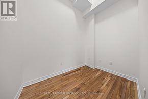 Carleton Place multi-family for rent - A realtor photo of a room with wood floors and white walls.