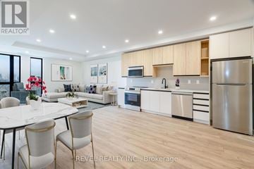 Lincoln (Beamsville) multi-family for rent - A modern kitchen with a dining table and chairs.