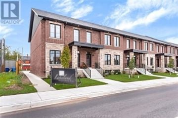 Windsor apartment for rent - A row of houses with a sign that says REALTOR in front of them.