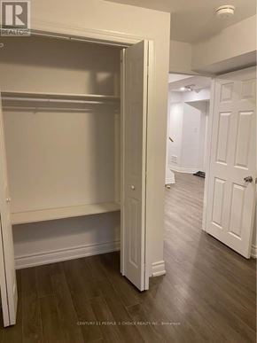 Milton (Co Coates) house for rent - A white closet with a door open is in a room with wood floors.