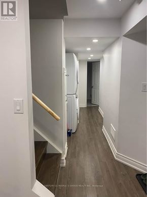 Milton (Co Coates) house for rent - A hallway with a wooden floor and white walls.