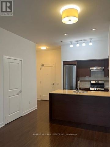 Toronto (Forest Hill South) house for rent - A kitchen with a sink and a stove top oven.