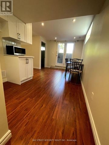 Toronto (Newtonbrook West) house for rent - A kitchen with white cabinets and a microwave.