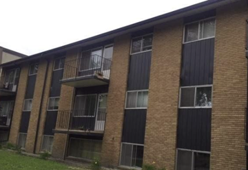Edmonton apartment for rent - A brick apartment building with balconies and windows.