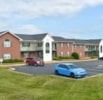 Youngsville apartment for rent - A blue car is parked in a parking lot.