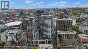 Hamilton apartment for rent - A cityscape with a mix of modern and older buildings under a clear sky.