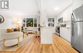 St. Thomas condo for rent - A modern kitchen with stainless steel appliances and a wooden floor.