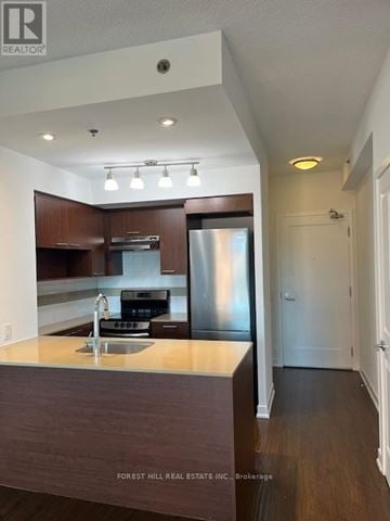 Toronto (Forest Hill South) house for rent - A kitchen with a sink, stove and refrigerator.