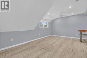 Kitchener house for rent - A room with wooden flooring and a window.