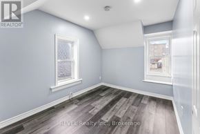 St. Catharines (E. Chester) duplex for rent - A room with grey walls and wooden flooring.