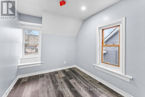 St. Catharines (E. Chester) duplex for rent - A room with a window and a picture on the wall.