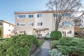 Victoria apartment for rent - A building with a pathway leading to the entrance.