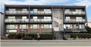 Victoria apartment for rent - A multi-story building with a sign that reads "Courtyard" on the front.