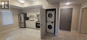 Aurora (Aurora Village) multi-family for rent - A laundry room with a washer and dryer stacked on top of each other.