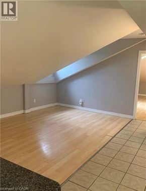 Dundas apartment for rent - A room with wooden flooring and a skylight.