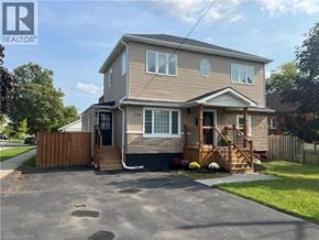 Stoney Creek house for rent - A two-story house with a garage and a deck.
