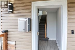 Stoney Creek house for rent - A mailbox is mounted on the side of a house.