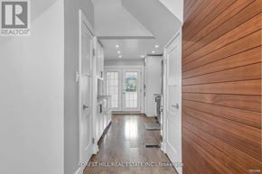 Hamilton (Gibson) house for rent - A hallway with a wooden floor and white walls.