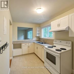 Ottawa multi-family for rent - A room with a doorway leading to a kitchen.