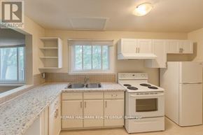 Ottawa multi-family for rent - A room with wooden flooring and a window.