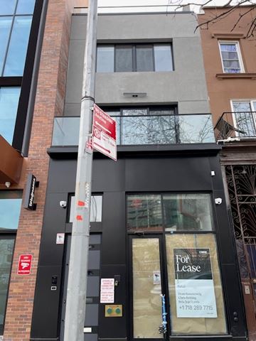 Brooklyn apartment for rent - A building with a for lease sign on the front.