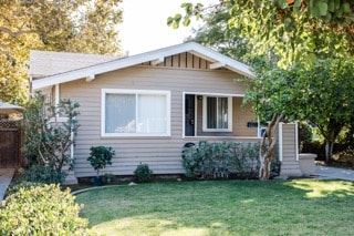 Fullerton apartment for rent - A house with a brown roof and a white window.