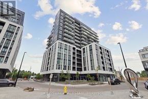Toronto (Tam O'shanter-Sullivan) condo for rent - A modern multi-story building with a parking lot in front.