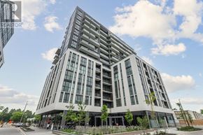 Toronto (Tam O'shanter-Sullivan) condo for rent - A modern multi-story building with a glass facade is the focus of the image.