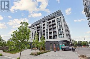 Toronto (Tam O'shanter-Sullivan) condo for rent - A modern multi-story building with a parking lot in front.