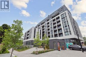 Toronto (Tam O'shanter-Sullivan) condo for rent - A modern multi-story building with a parking lot in front.